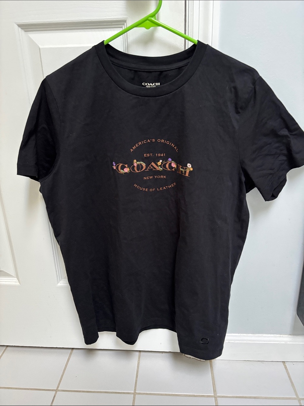 Coach Black Tee with Floral Logo